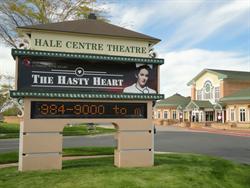 The sign for the Hale Centre Theatre features a horizontal banner for the current production and a scrolling electronic display. - , Utah
