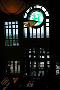 A stained-glass letter H stands above the main entrance doors in the lobby. - , Utah