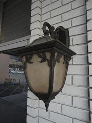 A decorative light fixture on the left side of the entrance. - , Utah