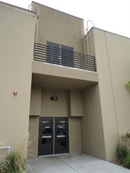 Exit doors in the center of the east wall, with second-level projection booth access. - , Utah