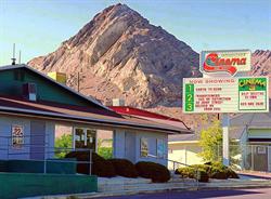 A rocky peak rises behind the Wendover Cinemas. - , Utah