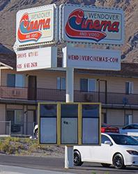 The sign on the corner only lists the theater's phone number and website.  The three poster cases remain empty. - , Utah