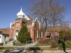 The former chapel is prominent on the left, while the theater entrance behind trees on right. - , Utah