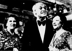 <p style='margin-bottom: 0in'>The opening-night audience in the Symphony Hall applauds Maurice Abravanel.  Standing with him are his wife, left, and Shirl H. Swenson, right.</p> - , Utah