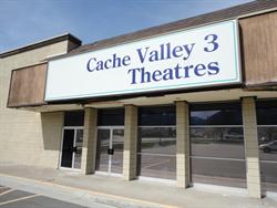 Two sets of exits doors beneath a sign bearing the name of the theater. - , Utah
