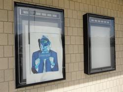 An anti-piracy poster remains in a poster case. - , Utah