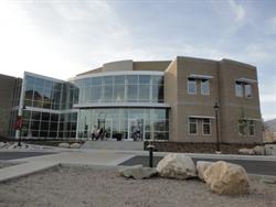 The entrance of the theater has a curving wall of glass windows. - , Utah