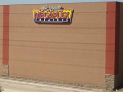 A sign for Larry H. Miller Megaplex Theatres, on the side of one of the two largest auditoriums. - , Utah