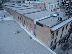 Looking down on the Rex Theatre building from the parking structure for the Broadway Centre.