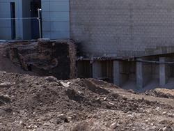 A basement brick wall, left, is all that remains of the Rex Theatre building following its demolition. - , Utah