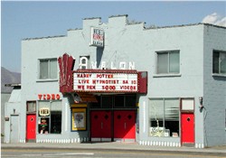 The Avalon Theatre in 2002, with a video rental store on the left and a barber shop on the right. - , Utah