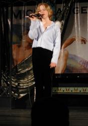 Jenika McCandless sings on stage. - , Utah