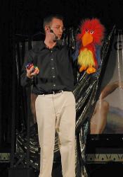 Josh Lawyer performs a juggling trick with the help of his ventriloquist puppet. - , Utah