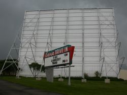 The sign of the Basin Drive-In, with the screen tower behind it. - , Utah