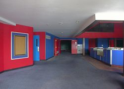 The lobby of the theater.  The entrance to one of the larger auditoriums is straight ahead.  On the left is the door to one of the smaller ones.  The other two theaters are on the other side of the concession stand, shown here on the right.