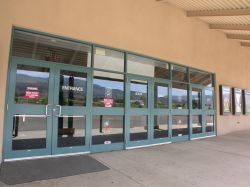 On the right of the ticket booth are one set of entrance doors and two sets of exit doors. - , Utah