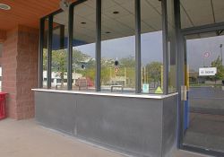 The ticket booth of the City Square 4 has three ticket windows and an entrance door on either side. - , Utah