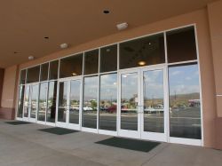 The entrance has three sets of doors, separated by windows. - , Utah