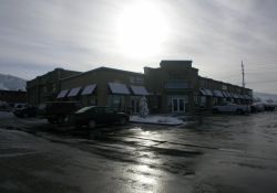 The retail space of the Country Club Marketplace.  The back of the office building is visible on the left. - , Utah