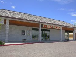 Front of the T & T Twin Theatres at the Plaza.  Out of the photo on the left is a bowling alley. - , Utah