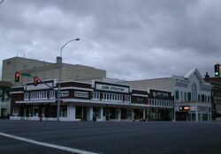 The front of the Ellen Eccles Theatre is on the right and the auditorium rises behind the stores on the left. - , Utah