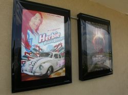 Posters for Herbie: Fully Loaded and War of the Worlds appear in poster cases outside the theater's entrance. - , Utah