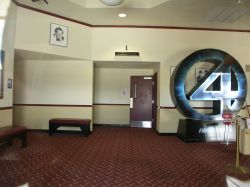 The entrance to Theater 1 is on the left side of the lobby.  A display for the movie The 'Fantastic 4' appears in the center of the lobby. - , Utah