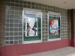 Posters for Mr. and Mrs. Smith and Herbie: Fully Loaded, in poster cases on the left side of the theater entrance. - , Utah