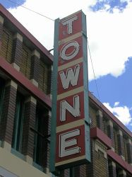 Above the entrance is a vertical blade sign with the name 'Towne' outlined in neon. - , Utah