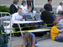 Star Wars fans with laptops sit at a picnic table while waiting in line for the midnight showing of Star Wars: Episode III: Revenge of the Sith. - , Utah