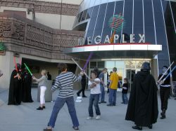 Several Star Wars fans duel with light sabers at the south entrance of the Megaplex 17 at Jordan Commons. - , Utah