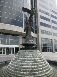 In front of the Jordan Commons office building is a fountain with a sculpture. - , Utah