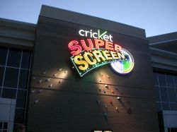 Mounted on the exterior wall above the north entrance of the Megaplex 17 at Jordan Commons is a neon sign for the Cricket Super Screen. - , Utah