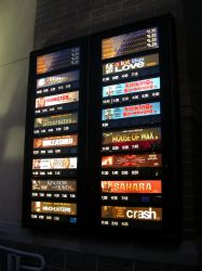 An attraction board lists movies, prices, and showtimes for films at the Megaplex 17 at Jordan Commons. - , Utah