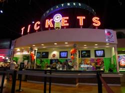 The main ticket counter is located in the center of the lobby.  Television screens display movies and showtimes. - , Utah