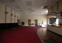 The lobby of the Lakeside Discount Cinemas, looking through the front doors.  The concession stand is on the right.  The entrance to one auditorium is out of the photo on the left and the door for the other auditorium is at the end of the lobby on the left. - , Utah