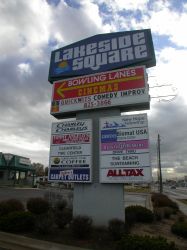 The sign for the Lakeside Square shopping center in Clearfield.  The section for the cinemas advertises 'Quickwits Comedy Improv', which uses the former theater along with the Apostolic Assembly of the Faith of Christ Jesus. - , Utah