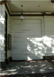 A garage door in the front of the building, south side. - , Utah