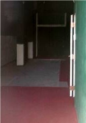A hallway on the north side of the building, seen through the dusty outside door. - , Utah