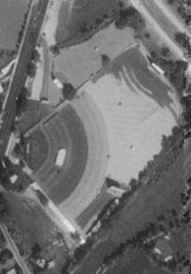 The Motor-Vu Drive-In in a 1997 aerial photo.  The theater entrance, in the upper left has a long entry drive to the ticket booths.  South of that is the main theater. 