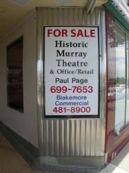 A 'for sale' poster on one of the diagonal walls in the Murray Theatre entrance. - , Utah
