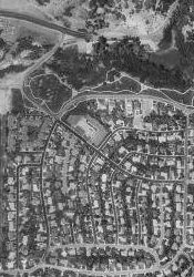 This aerial photo from 1997 shows the subdivision that replaced the Oak Hills Drive-In.  The edge of Hogle Zoo appears in the upper left corner of the photo. - , Utah