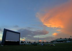 A few moviegoers wait for dusk at the Open Air Cinema at the Salt Lake County
Events Center & Equestrian Park in South Jordan.