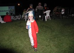 A child in a clown costume at an Open Air Cinema event. - , Utah