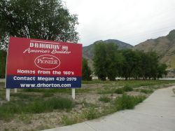 A sign for D R Horton stands on the corner of the former drive-in site.  The trees on the right bordered the south side of Theater 1. - , Utah