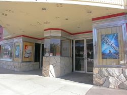 The entrance of the theater has a single ticket window with double doors on either side. - , Utah