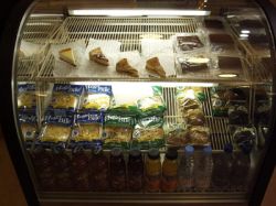 A refridgerated display case with pies and other desert items. - , Utah