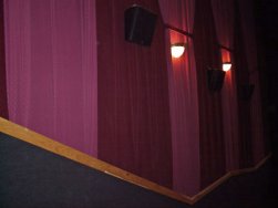 The walls of the auditoriums at the Redstone 8 Cinemas are covered with draperies in alternating shades of red. - , Utah