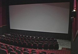 One of the larger theaters at the Redstone 8 Cinemas, from the back looking down at the 40-foot wide movie screen.  The four larger auditoriums have 175 to 193 seats each and feature stadium seating and Dolby Digital sound systems.