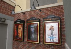 Three poster cases on a red brick wall outside the Redstone 8 Cinemas. - , Utah